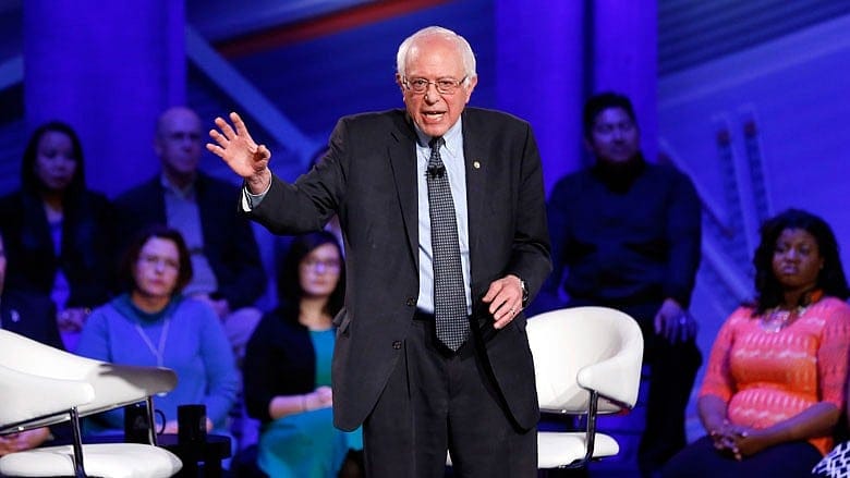 Sanders, now a contender, still preaches revolution