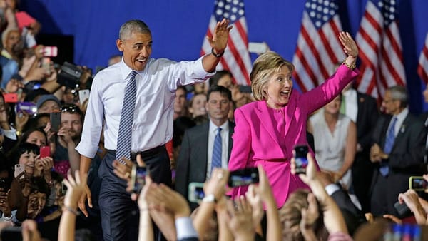 ‘Ready to pass the baton’: Obama campaigns with Clinton