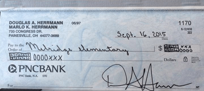 A father's photo went viral after he wrote a check using "Common Core numbers." (Facebook)