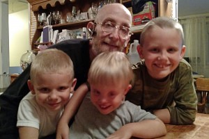 James, 6, Josiah, 4, and Jesse, 9, with their father, Carl, at their home in Carver, Mass. (Courtesy Julie Stone)
