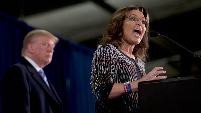 Former Alaska Gov. Sarah Palin, right, endorses Republican presidential candidate Donald Trump during a rally at the Iowa State University, Tuesday, Jan. 19, 2016, in Ames, Iowa. (AP Photo/Mary Altaffer)