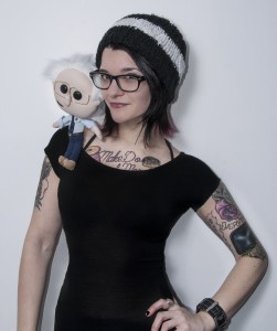 Emily Engel with a Lil' Bernie doll (Cloverleaf Imaging).