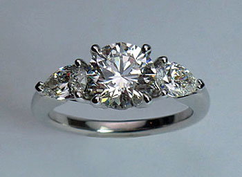 Platinum and diamond solitaire with pear-shaped side stones (Courtesy of Firestone and Parson)