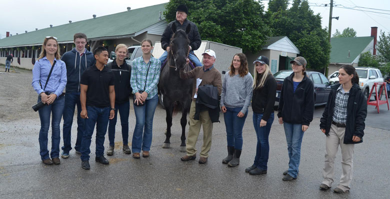 Students with Hall of Fame trainer Jack Van Berg (on horse) and jockey Chris McCarron (white hat). (Courtesy of Sarah Dudik/Bluegrass Community and Technical College)