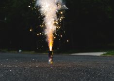 Fireworks exploding on a small quiet street